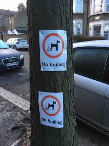east london funny garden blog, picture of a tree with two "no fouling" signs